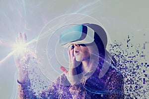 A person in virtual glasses flies to pixels. The woman with glasses of virtual reality. Future technology concept