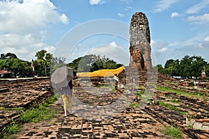 Person walking in Wat Lokayasutharam temple place in Ayutthaya