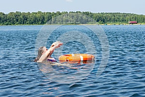 A person in the water gets a lifeline to help. The concept of saving drowning