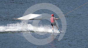 Person water-skiing on a lake in Niedersfeld, Germany