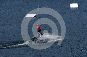 Person water-skiing on a lake in Niedersfeld, Germany