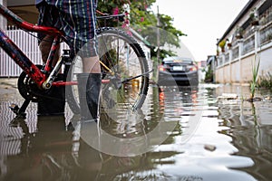 Person wear rubber boots,prevent infection of leptospirosis,athlete`s foot,disease from dirty water,male in waterproof boots in a