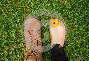 Person wearing barefoot boots shoes, which are wide, comfortable and healthy concept. photo