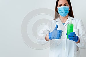 Person Wearing Medical Gown Gloves For Performing Laboratory Experiment. Holding Test Tube Of Blood For Health Condition