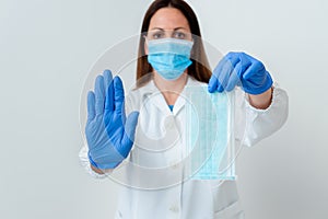 Person Wearing Medical Gown Gloves For Performing Laboratory Experiment. Holding Test Tube Of Blood For Health Condition