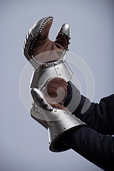 Person Wearing Medieval Gauntlets Showing Palms photo