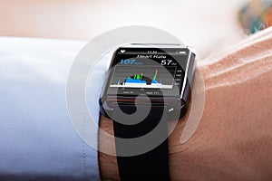 Person Wearing Smart Watch Showing Heartbeat Rate