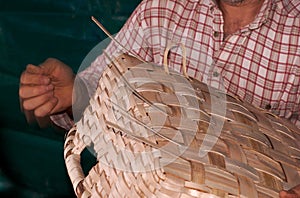 Person Weaving Basket