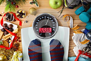 Person weighing on a scale after the Christmas holidays