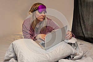 Person working in bed