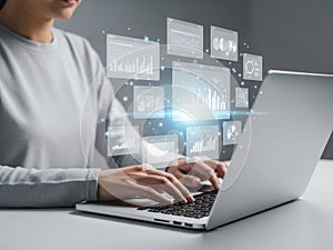 Person working on laptop with data visualization and analytics interface