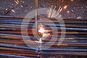 A person works with welding, sparks, close up, construction