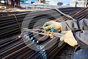 A person works with welding, sparks, close up, construction