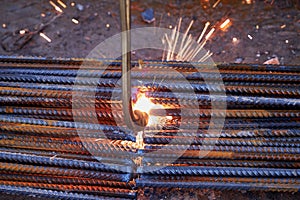 A person works with welding, sparks, close up, construction photo