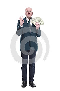personable business man with a wad of dollar bills