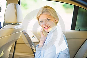 Personal assistant and driver. Business life concept. Business woman sit on backseat. Busy lady passenger leather car