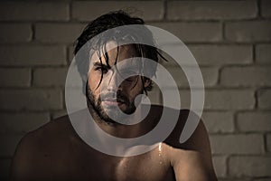 Personal care. man with wet hair, muscular body in bath, shower