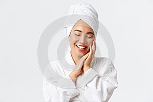 Personal care, women beauty, bath and shower concept. Close-up of beautiful happy asian woman in towel and bathrobe