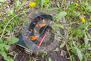 Personal computer graphics card thrown into the grass due to breakage