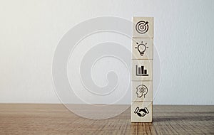 Personal development and career growth concept, wooden cubes with career promotion icon and the concept of development icon