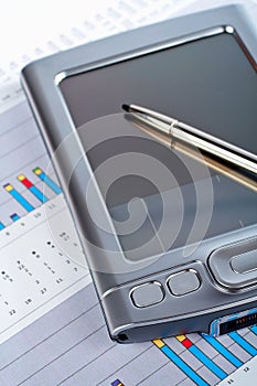 Personal digital assistant on market financial chart background