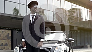 Personal driver waiting for arrival of boss at airport, transfer service