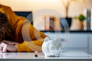 Personal finances, woman putting money into a piggy bank- -wealth and financial concept