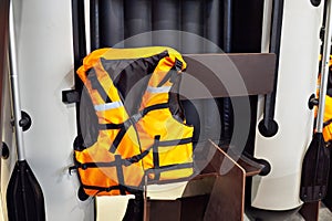 Personal flotation device as life jacket and boat in store photo