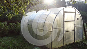 Personal greenhouse for cucumbers in the country.