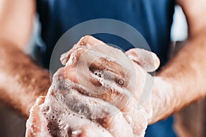 Personal hygiene - thorough hand washing with soap - close-up of male hands