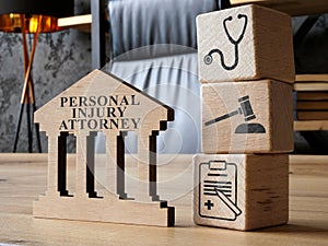 Personal injury attorney sign and cubes as a concept of law.