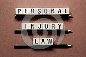 Personal injury law word concept on cubes