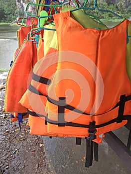 Personal life support flotation safety device life jacket, life vest, work vest, life saving, buoyancy aid or flotation suit for photo