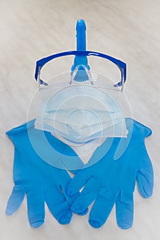 Personal protective equipment during the coronavirus epidemic - goggles, a disposable medical mask, disposable nitrile gloves, a