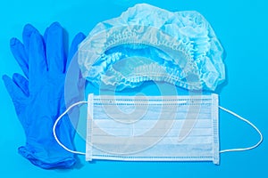 Personal protective equipment - medical mask, hat, rubber gloves photo