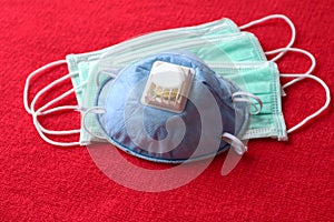The personal protective equipment N95 respiratory blue mask and surgical mask, for protect respiration from corona virus COVID-19 photo