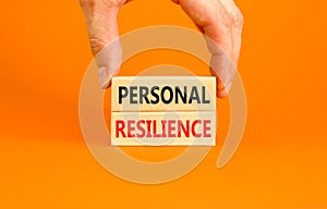 Personal resilience symbol. Concept word Personal resilience on wooden block. Beautiful orange table orange background.