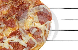 Personal size pepperoni pizza on a wire rack