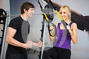 Personal trainer assist woman