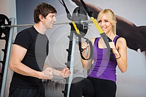 Personal trainer assist woman photo