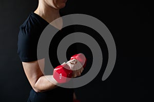 Personal trainer demonstrating dumbbell workout