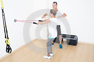 Personal trainer explaining a fitness exercise