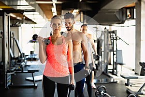 Personal trainer helping woman to working out in gym. Healthy lifestyle sport people concept