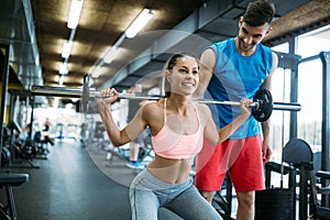 Personal trainer instructing trainee