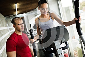 Personal trainer instructing trainee