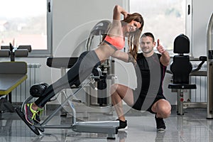 Personal Trainer Showing Ok Sign To Client