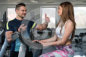 Personal Trainer Showing Ok Sign To Client