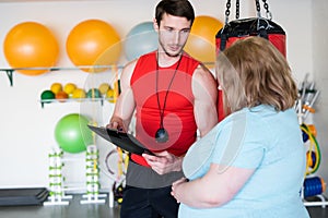 Personal Trainer Talking to Client