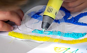 A persone drawing 3d pen that hardens in the air close-up.