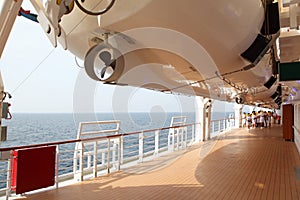 Personnel conduct rescuer training on ship deck photo